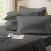 Dark grey oxford standard pillowcases premium 400 thread count on pillows on bed in bedroom