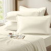Ivory oxford standard pillowcases premium 400 thread count on pillows on bed in bedroom