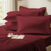 Rio red oxford standard pillowcases premium 400 thread count on pillows on bed in bedroom