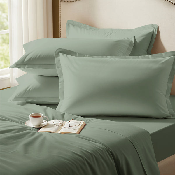 Sea foam oxford standard pillowcases premium 400 thread count on pillows on bed in bedroom