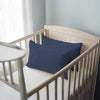 Toddler bed with dark blue 40 x 60 cm cotton pillowcase on the pillow