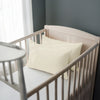 Toddler bed with ivory 33 x 46 cm cotton pillowcase on the pillow