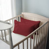 Toddler bed with rio red 33 x 46 cm cotton pillowcase on the pillow